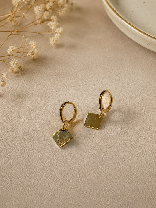 gold-toned huggie-style hoop earrings