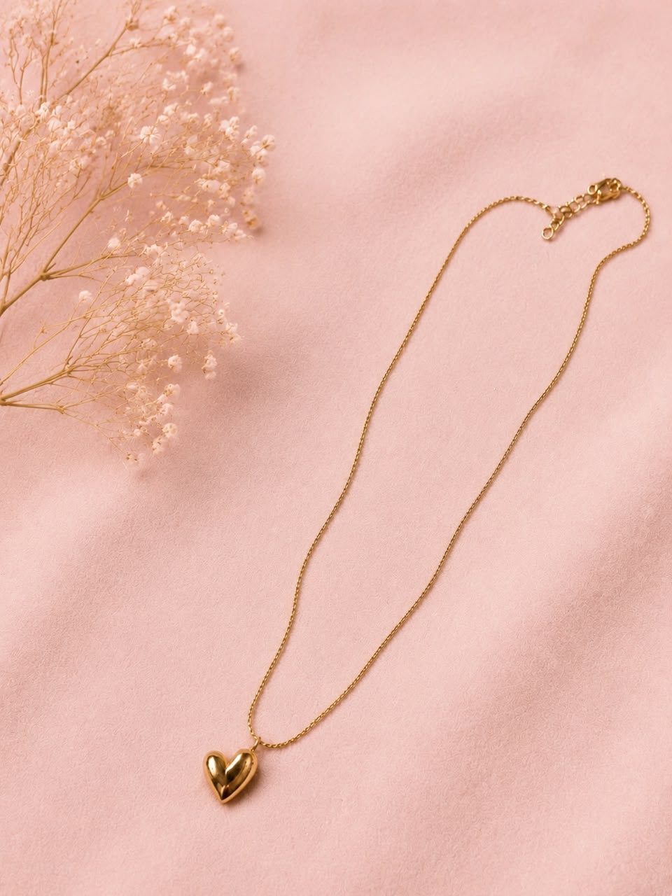 subtle heart-shaped pendant.