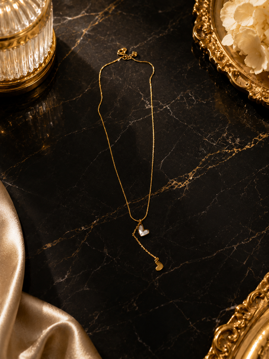 gold lariat-style pendant
