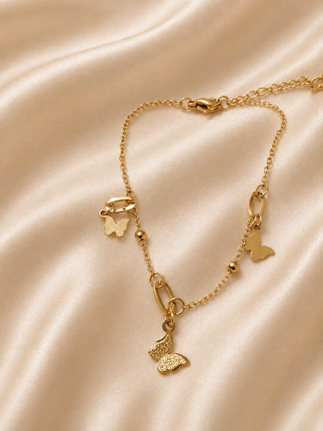 a dainty butterfly-themed anklet