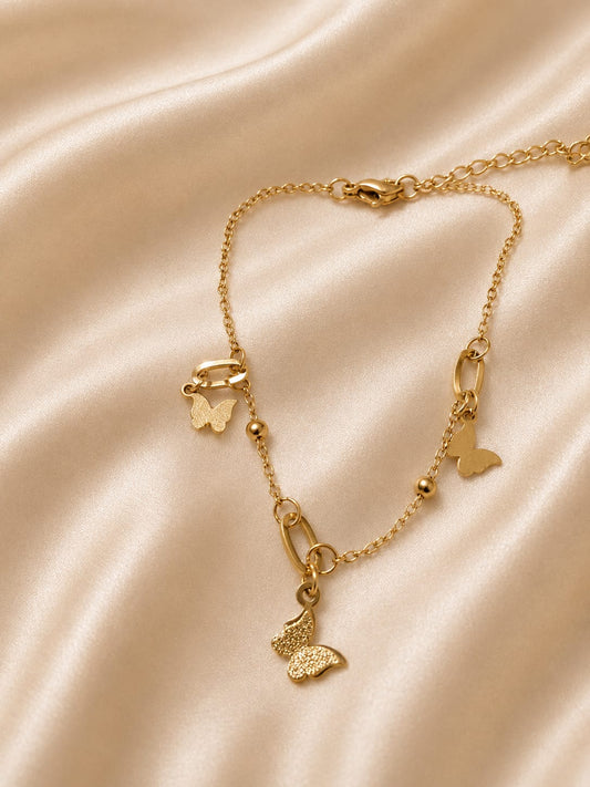 a dainty butterfly-themed anklet